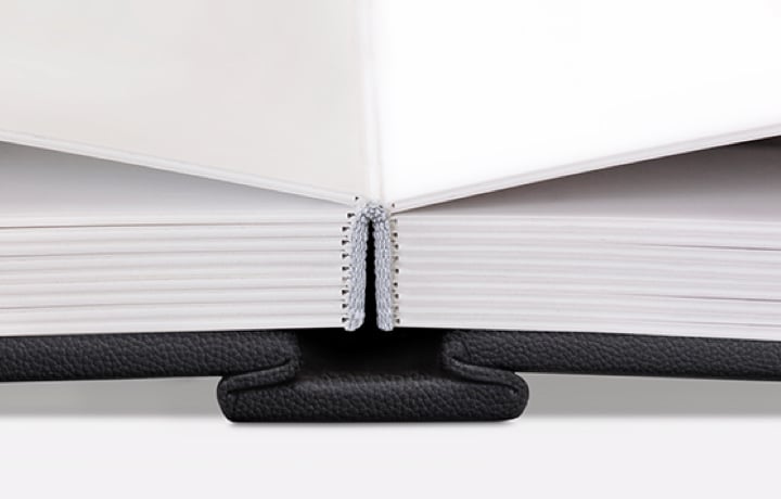 Close up of MILK Photo Album showing flush mount, lay-flat binding and thick board pages